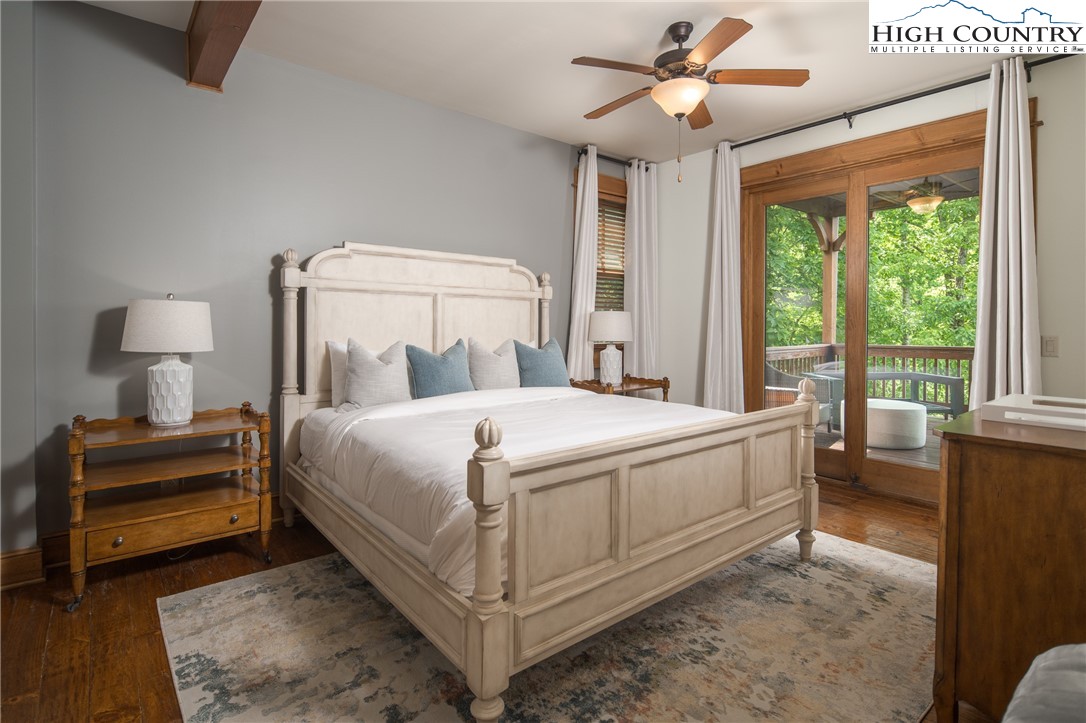 153 Stonecrop Lane Boone, NC 28607 - Photo 27 of 49 a bed sitting in a bedroom next to a window