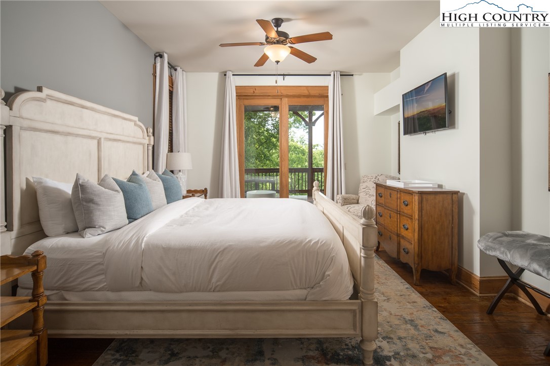 153 Stonecrop Lane Boone, NC 28607 - Photo 28 of 49 a bedroom with a bed and a window