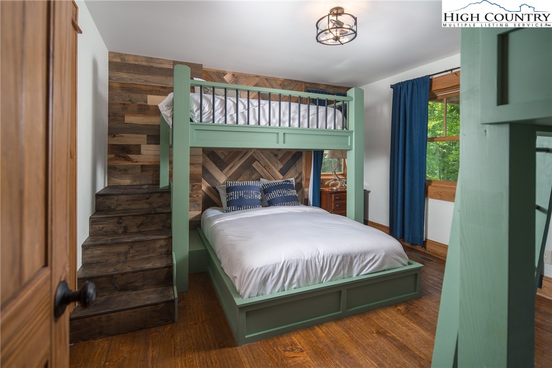 153 Stonecrop Lane Boone, NC 28607 - Photo 36 of 49 a bedroom with a bed and a window