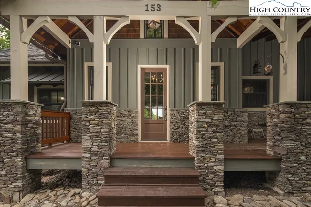 a view of a chairs and table in the balcony