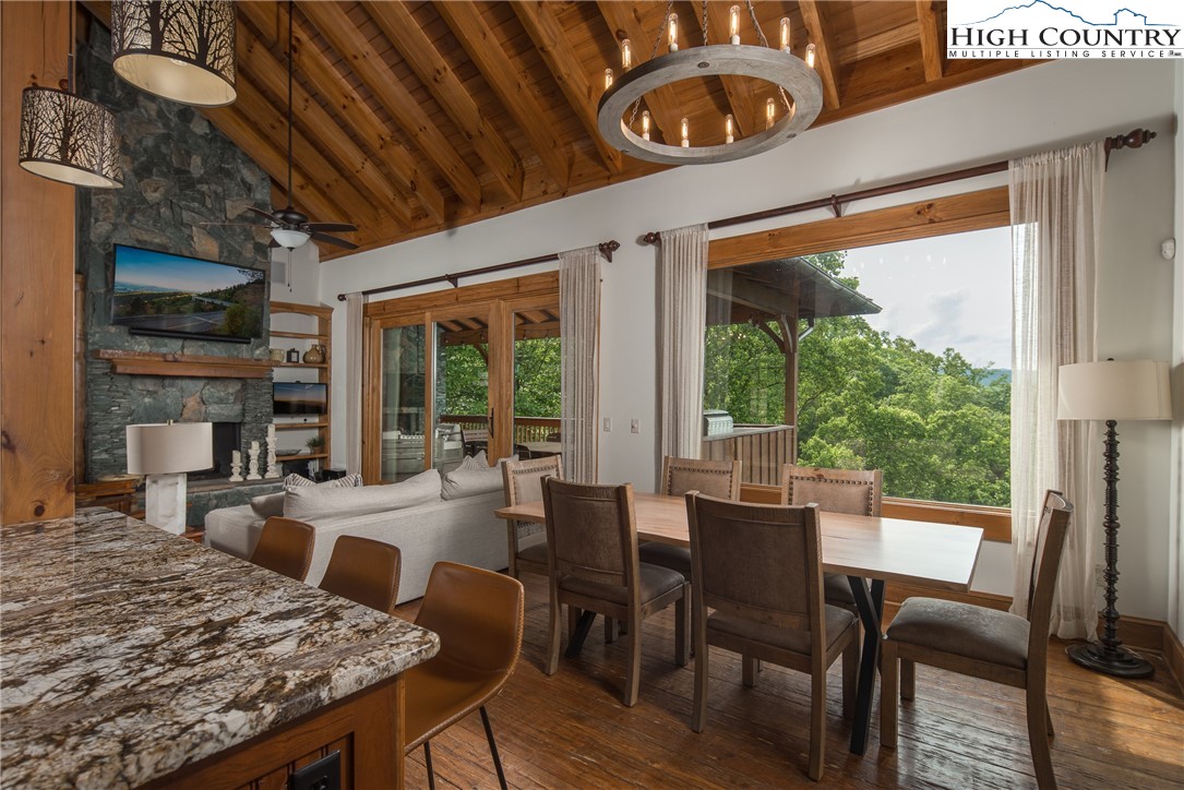 153 Stonecrop Lane Boone, NC 28607 - Photo 4 of 49 a view of a dining room with furniture window and outside view