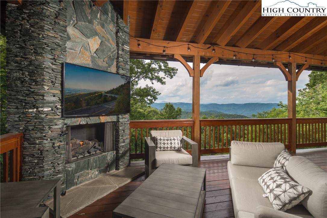 153 Stonecrop Lane Boone, NC 28607 - Photo 7 of 49 a balcony with furniture and a potted plant
