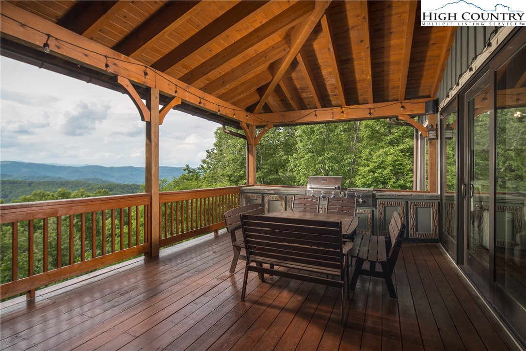 153 Stonecrop Lane Boone, NC 28607 - Photo 8 of 49 a view of a balcony with furniture and wooden floor