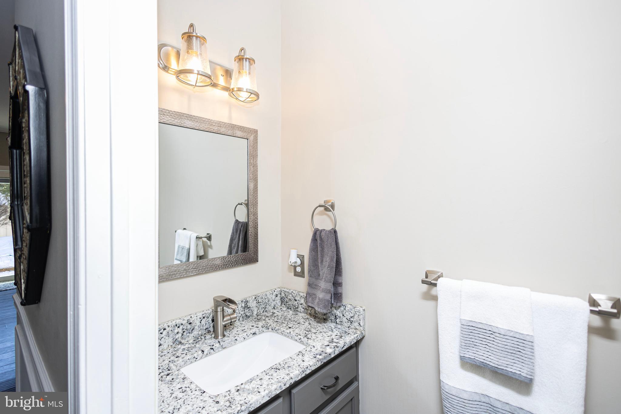317 Pickwick Drive Williamstown, NJ 08094 - Photo 11 of 52 a bathroom with a sink and a mirror