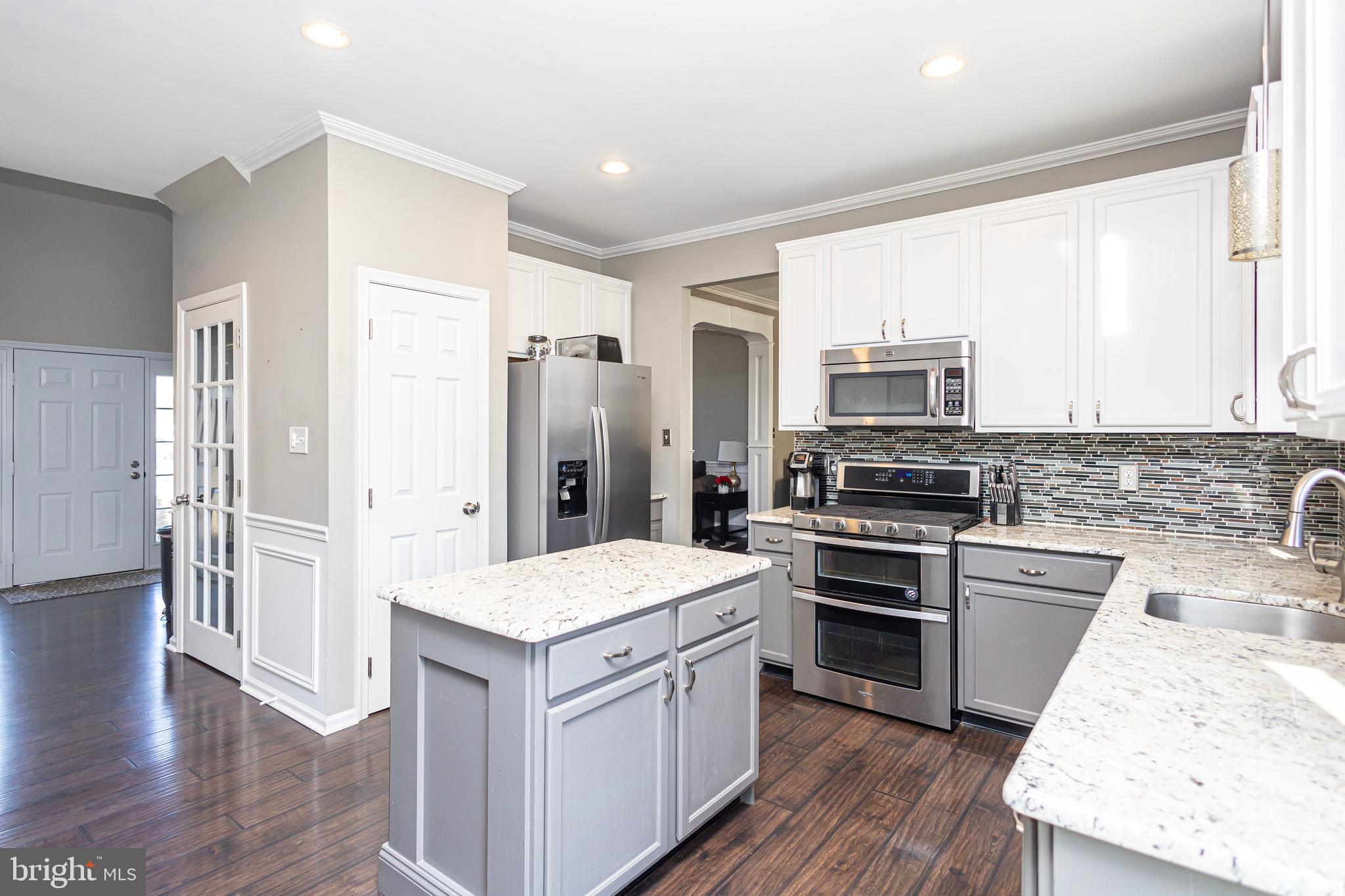 317 Pickwick Drive Williamstown, NJ 08094 - Photo 13 of 52 a kitchen with a refrigerator stove and sink
