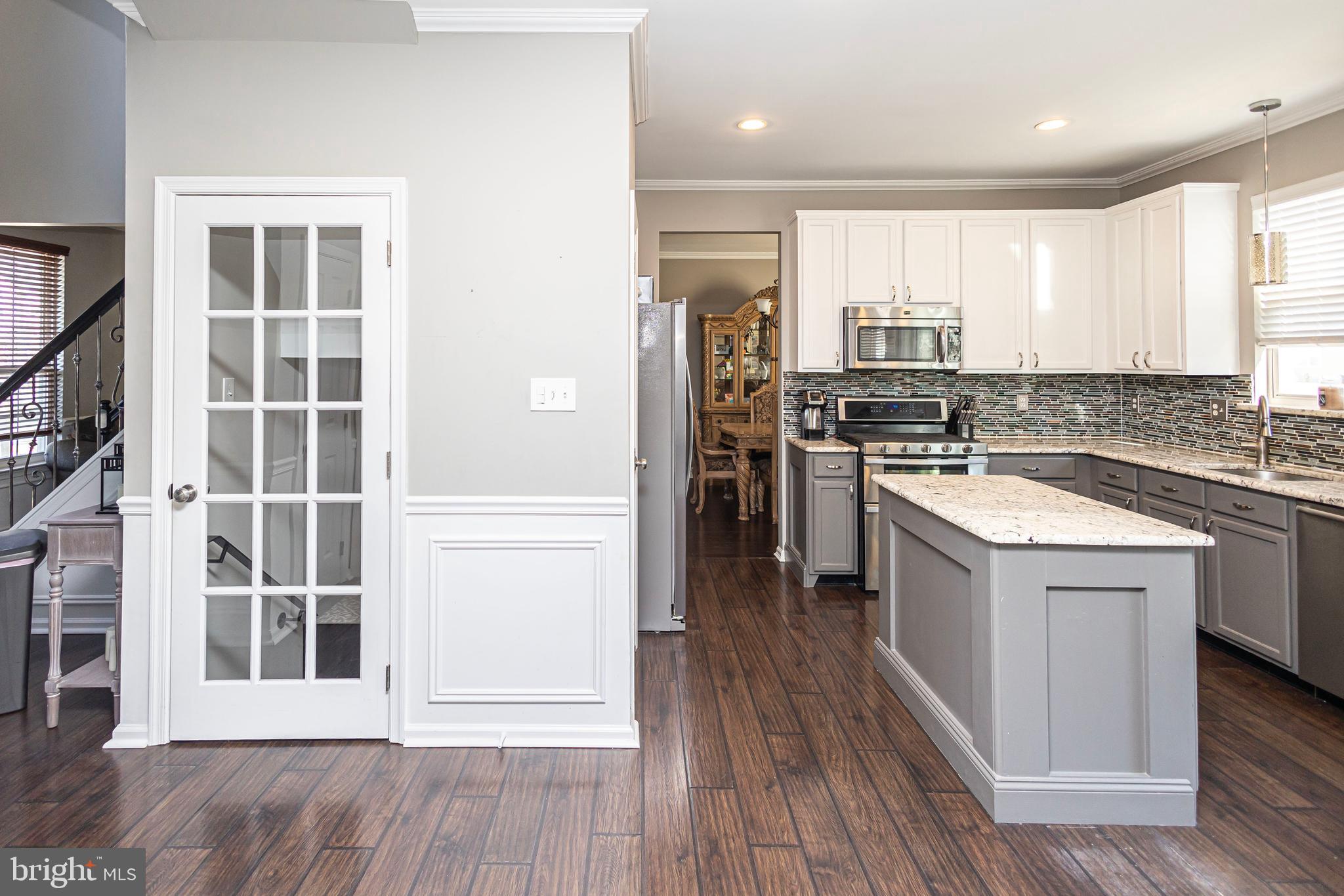 317 Pickwick Drive Williamstown, NJ 08094 - Photo 15 of 52 a kitchen with a sink stove and refrigerator