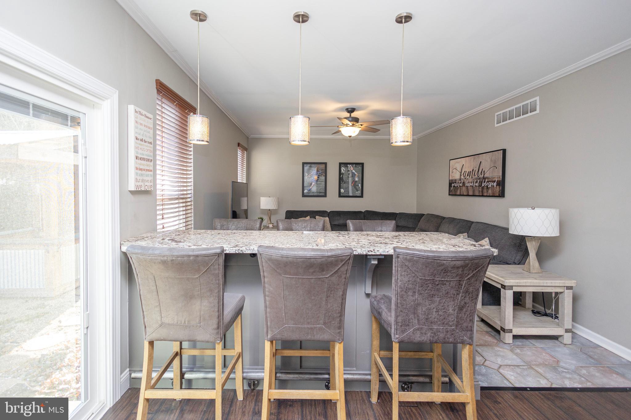 317 Pickwick Drive Williamstown, NJ 08094 - Photo 16 of 52 a view of a dining room with furniture and wooden floor