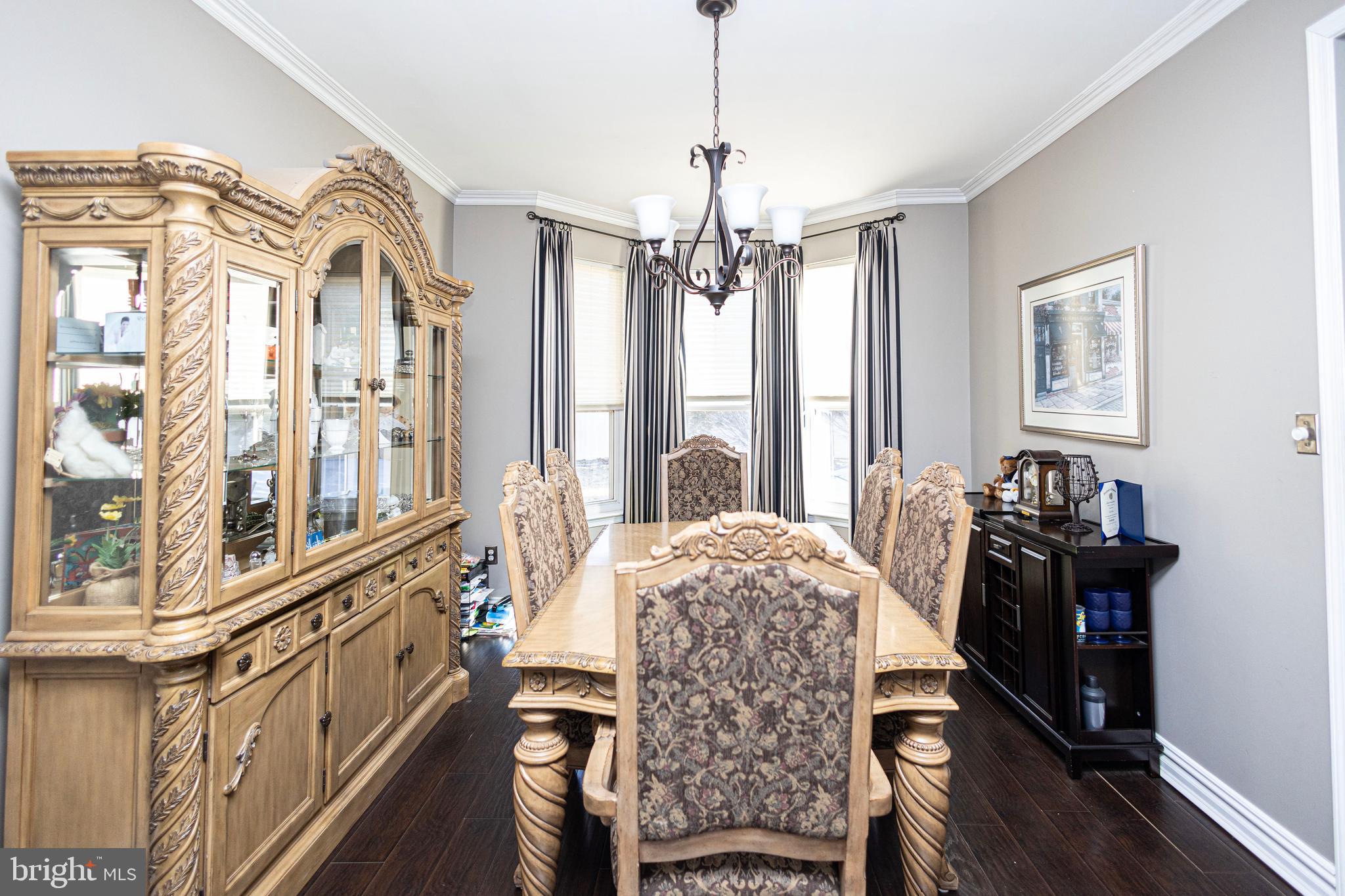 317 Pickwick Drive Williamstown, NJ 08094 - Photo 17 of 52 a spacious bedroom with a bed a chandelier and a window