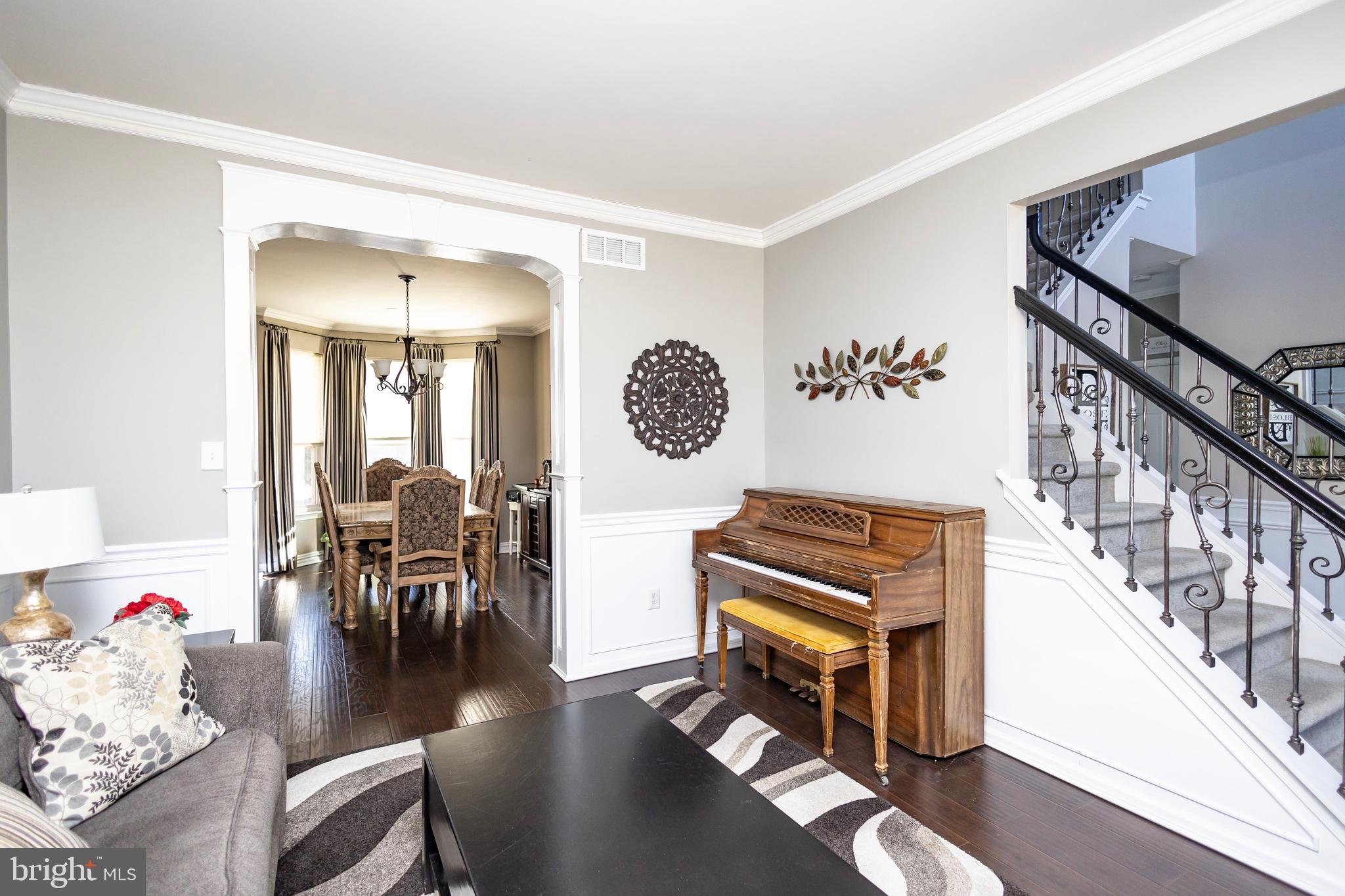 317 Pickwick Drive Williamstown, NJ 08094 - Photo 19 of 52 a living room with furniture and a wooden floor