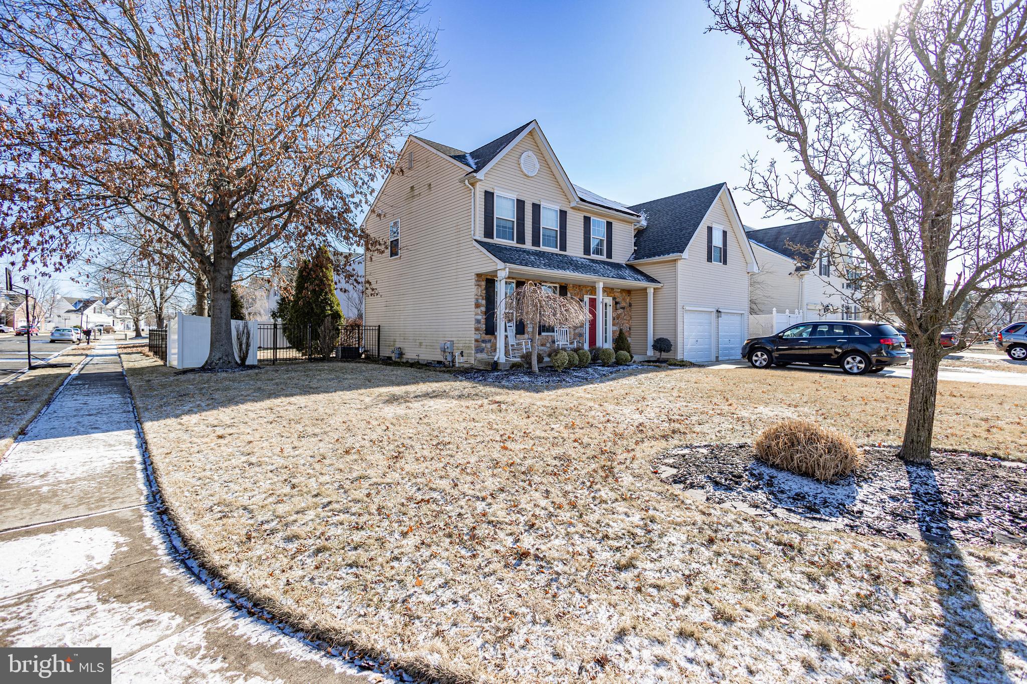 317 Pickwick Drive Williamstown, NJ 08094 - Photo 2 of 52 a front view of a house with a yard covered in snow