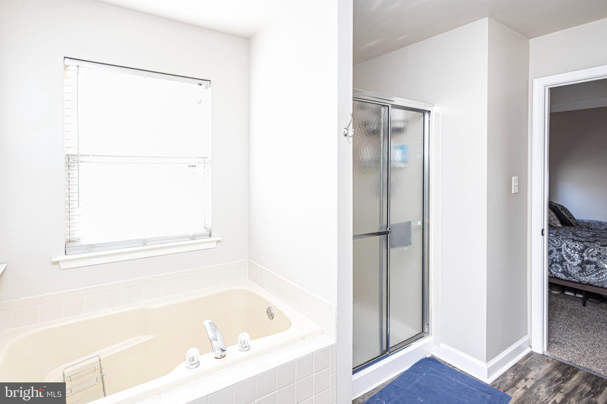 317 Pickwick Drive Williamstown, NJ 08094 - Photo 26 of 52 a bathroom with a bathtub and a shower