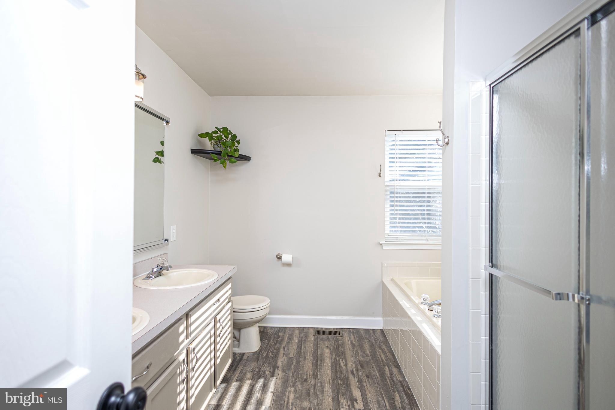 317 Pickwick Drive Williamstown, NJ 08094 - Photo 27 of 52 a bathroom with a granite countertop shower and a toilet
