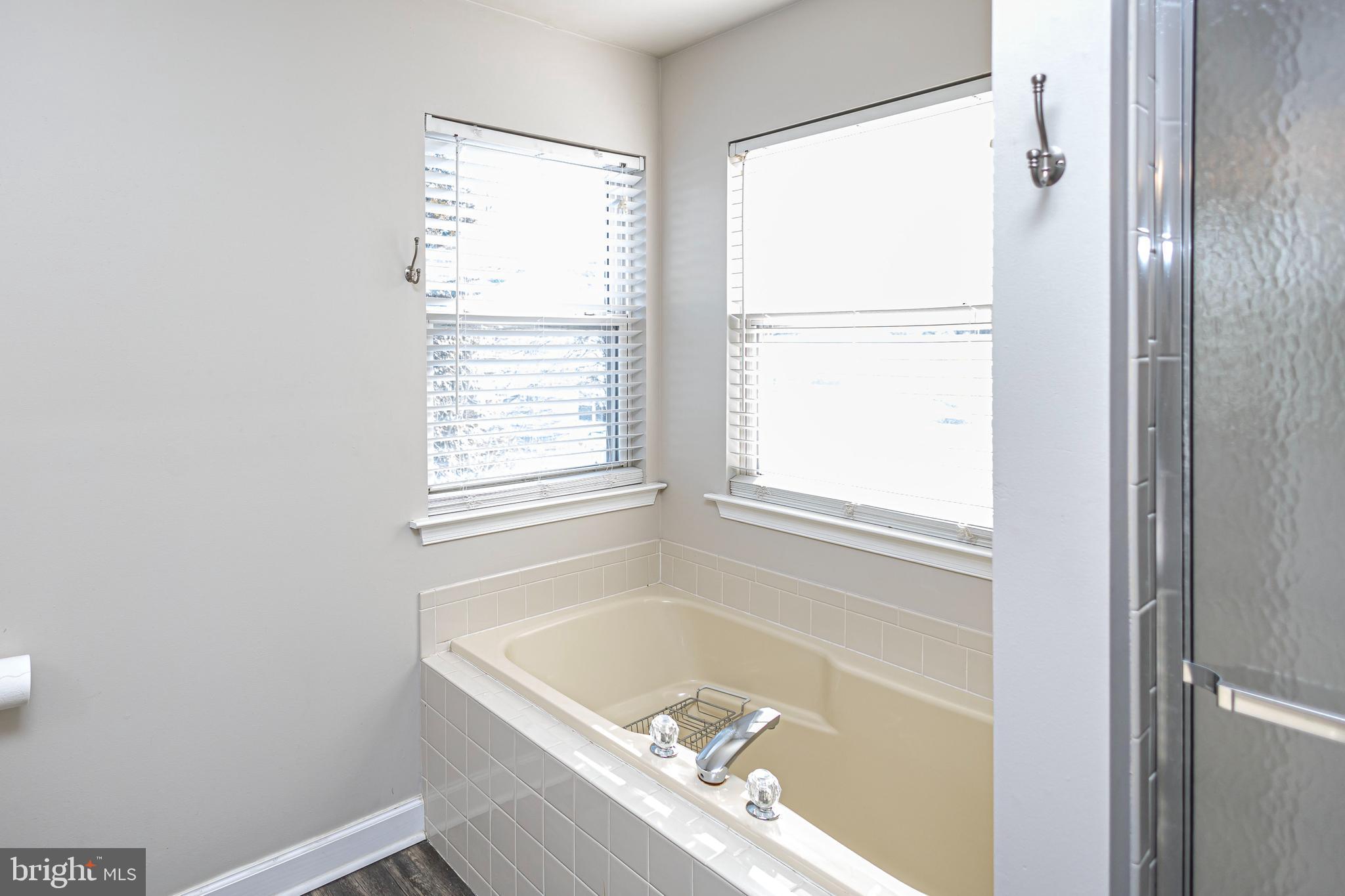 317 Pickwick Drive Williamstown, NJ 08094 - Photo 28 of 52 a bathroom with a tub and shower