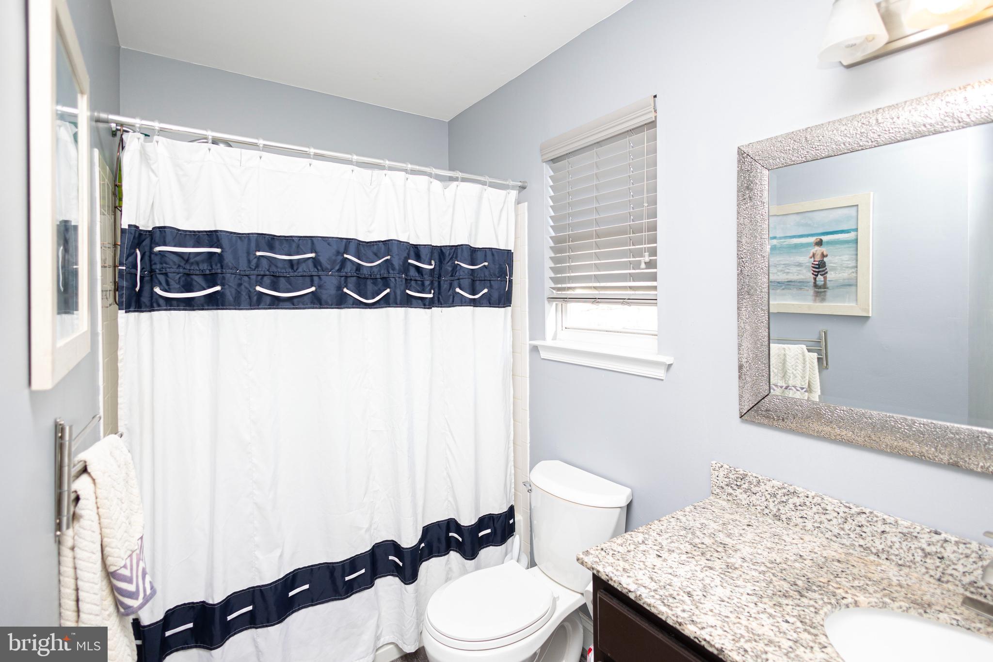 317 Pickwick Drive Williamstown, NJ 08094 - Photo 29 of 52 a bathroom with a granite countertop sink mirror vanity and toilet