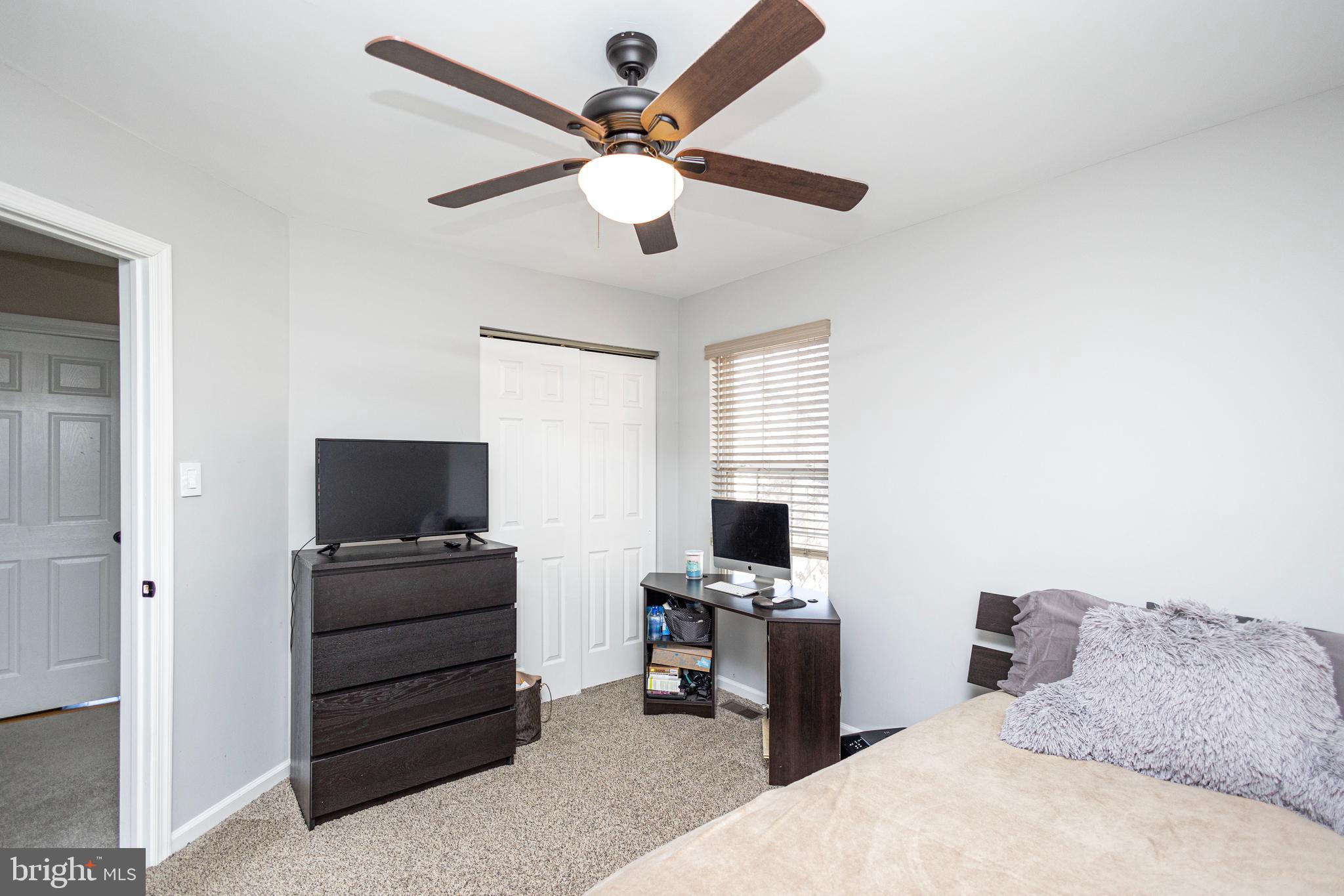 317 Pickwick Drive Williamstown, NJ 08094 - Photo 31 of 52 a bedroom with a bed and a flat screen tv