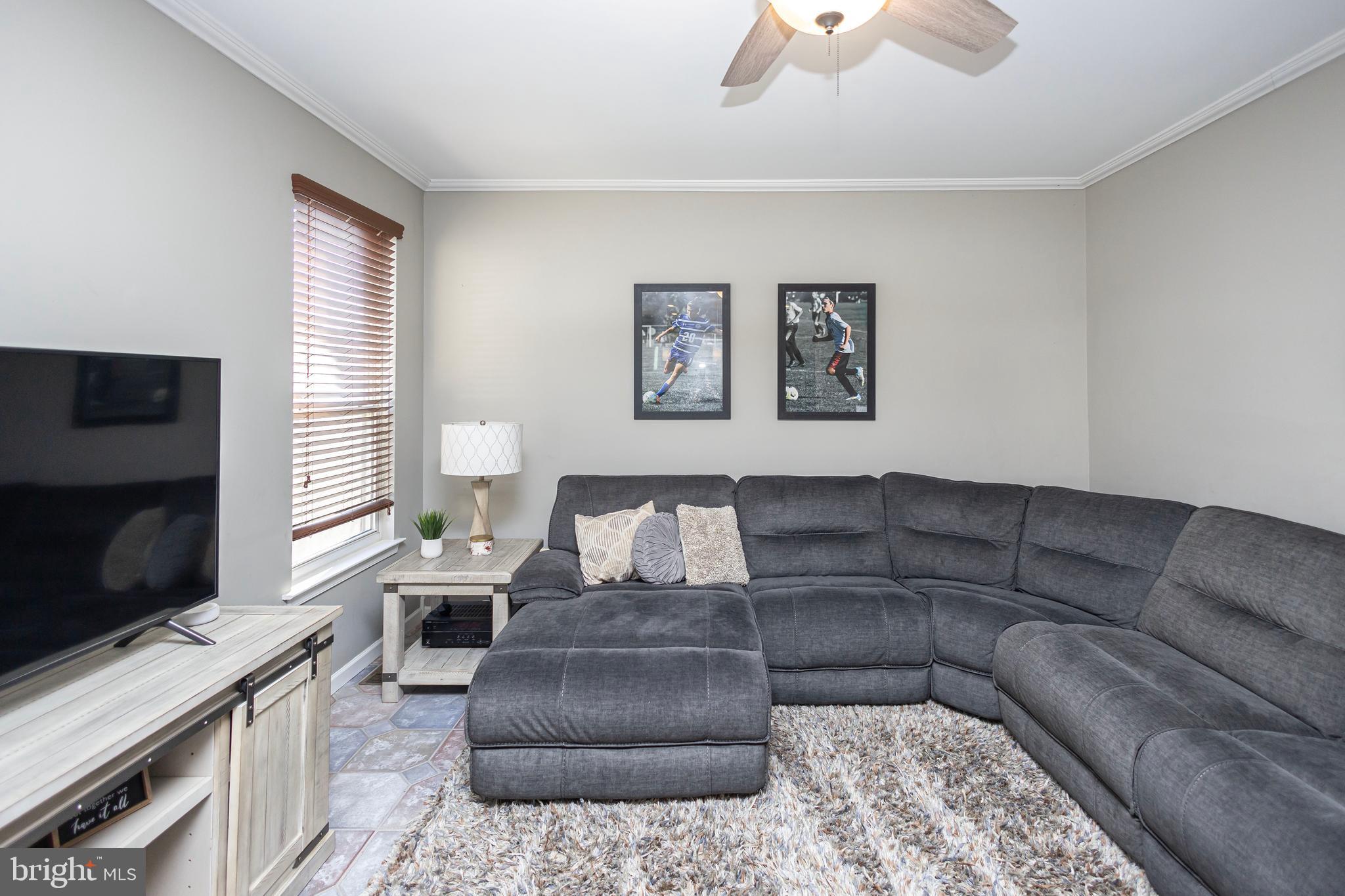 317 Pickwick Drive Williamstown, NJ 08094 - Photo 8 of 52 a living room with furniture and a flat screen tv