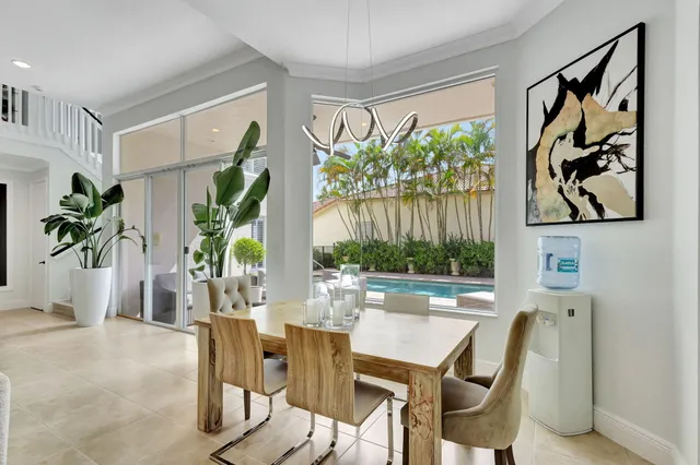 a spacious bathroom with a tub sink and mirror
