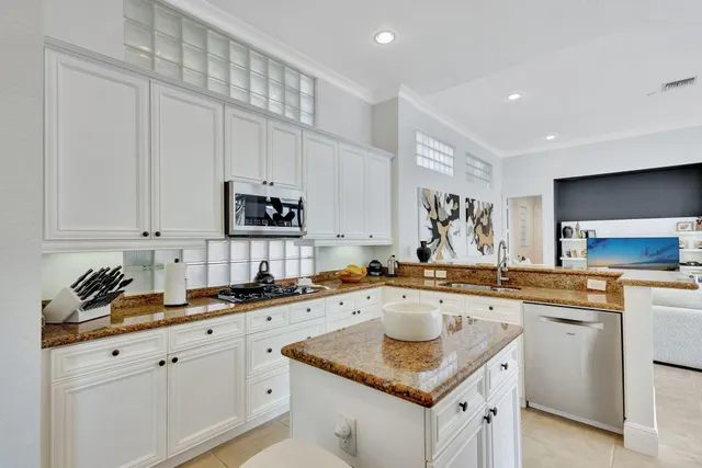 a view of a hallway with wooden floor and stairs