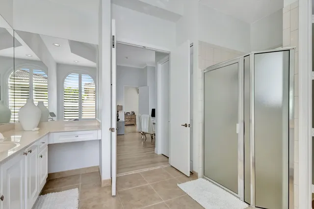 an aerial view of house with yard and swimming pool