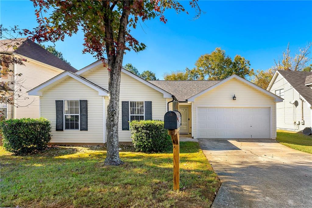 3673 Waldrop Cliff Lane Decatur, GA 30034 - Photo 1 of 1 a front view of a house with a yard and garage