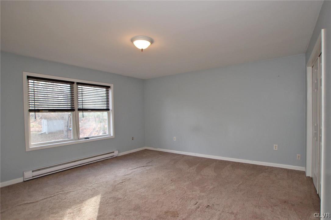 160 Spruce Drive Dingmans Ferry, PA 18328 - Photo 11 of 40 an empty room with a window