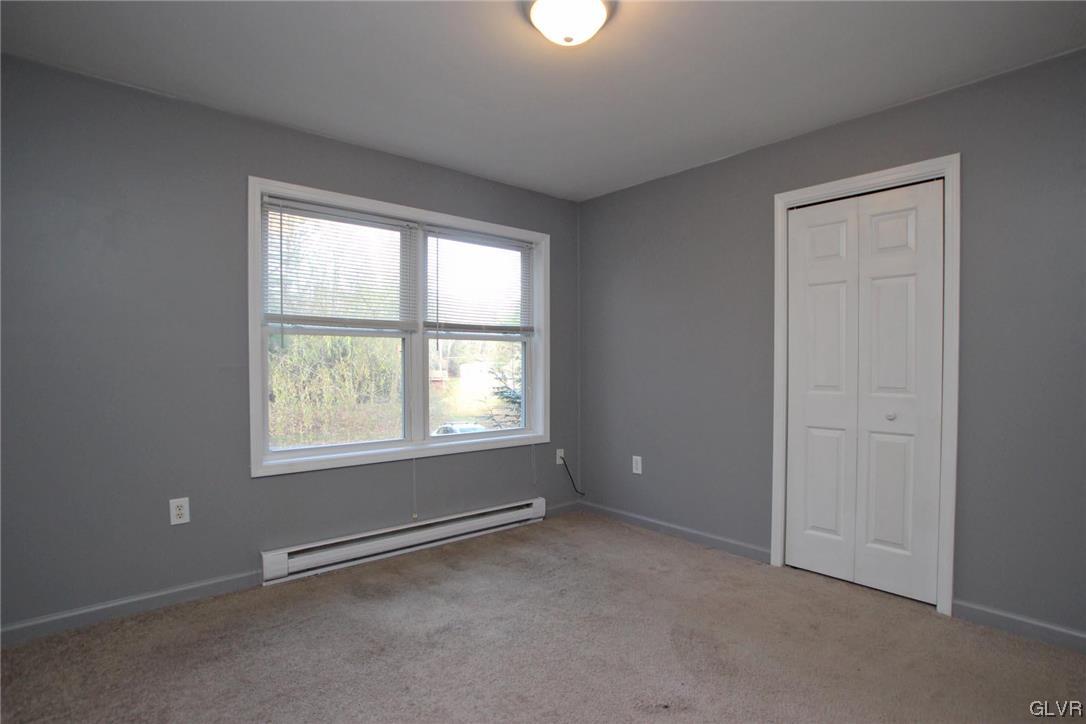 160 Spruce Drive Dingmans Ferry, PA 18328 - Photo 15 of 40 an empty room with a window