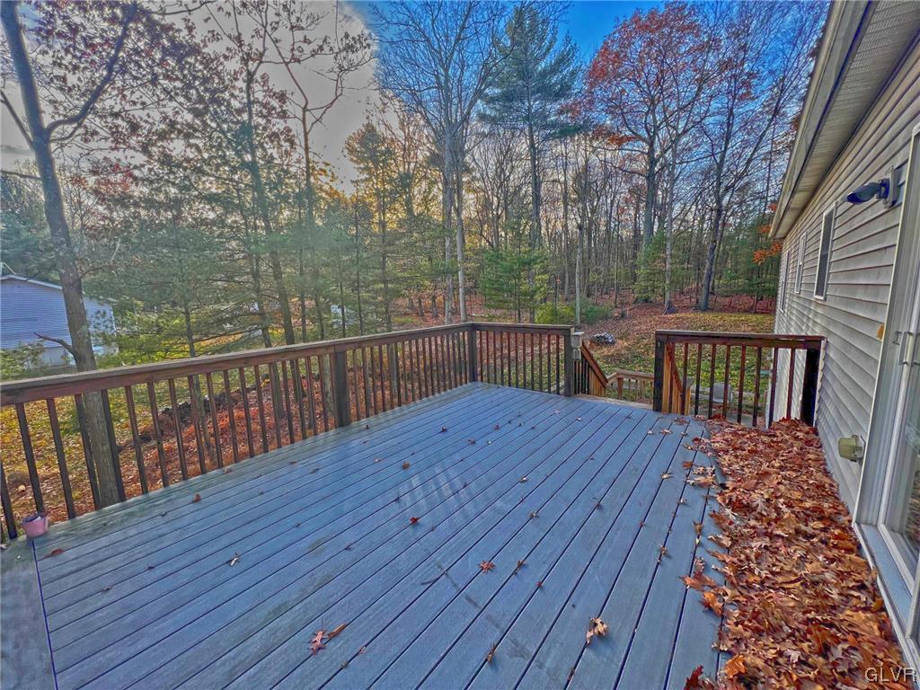 160 Spruce Drive Dingmans Ferry, PA 18328 - Photo 25 of 40 a view of wooden deck with a patio