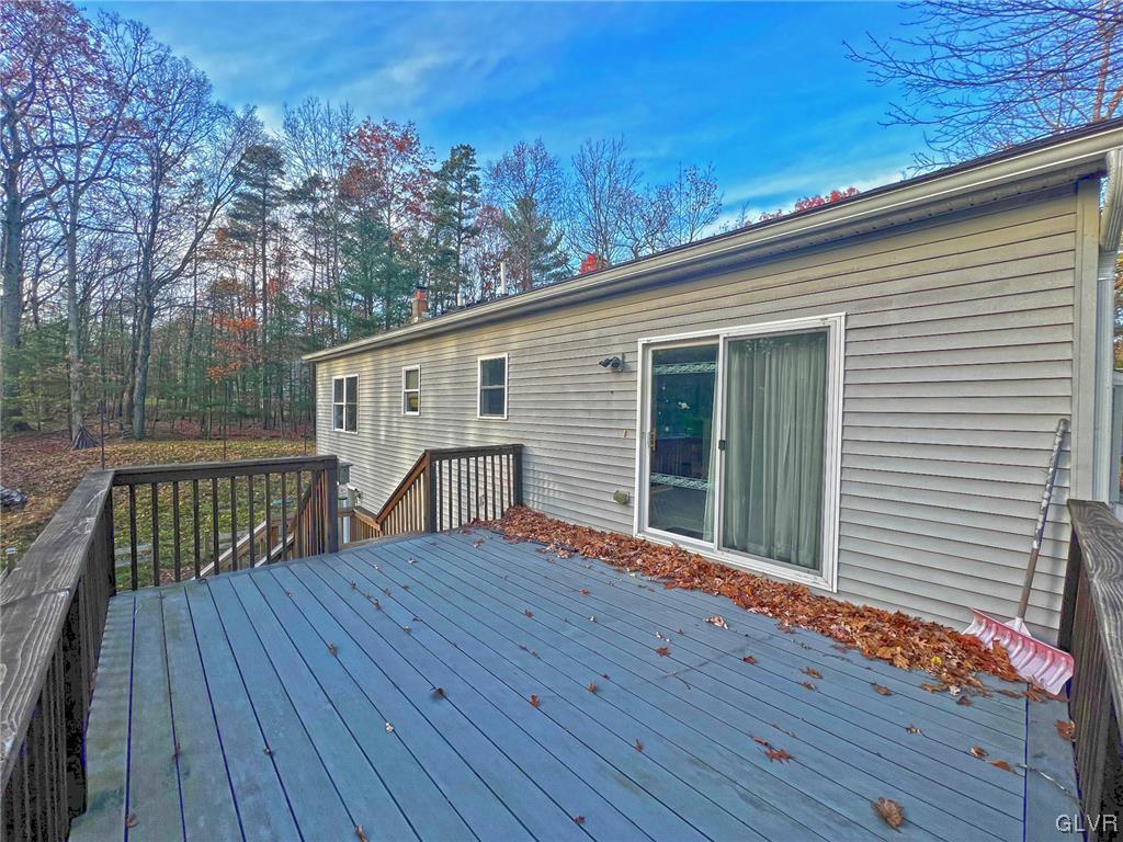 160 Spruce Drive Dingmans Ferry, PA 18328 - Photo 26 of 40 a view of backyard with a deck and wooden floor