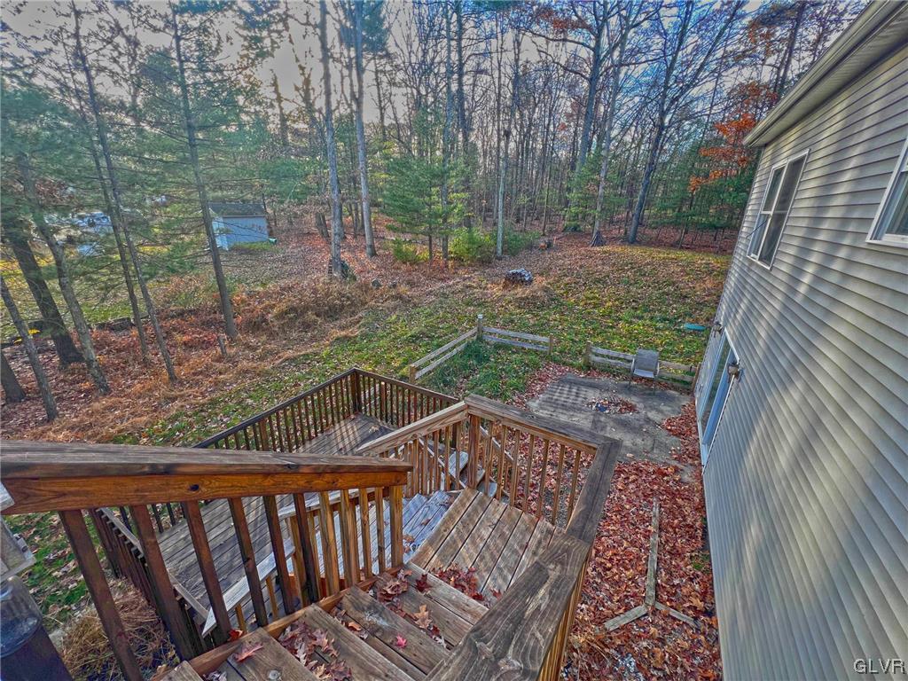 160 Spruce Drive Dingmans Ferry, PA 18328 - Photo 27 of 40 a view of deck with wooden floor and outdoor seating