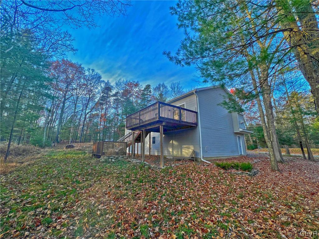 160 Spruce Drive Dingmans Ferry, PA 18328 - Photo 28 of 40 a front view of a house with garden