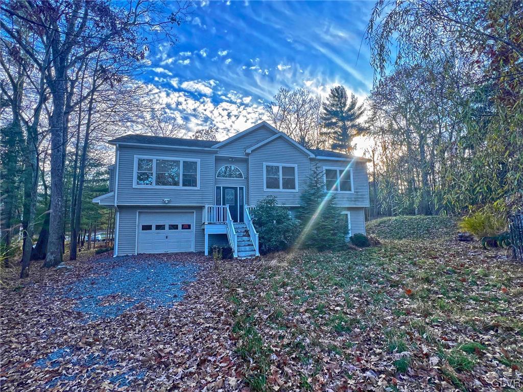 160 Spruce Drive Dingmans Ferry, PA 18328 - Photo 30 of 40 a view of a house with a yard and large tree