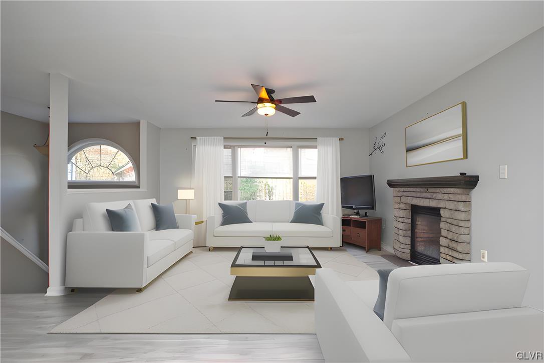 160 Spruce Drive Dingmans Ferry, PA 18328 - Photo 3 of 40 a living room with furniture and a fireplace