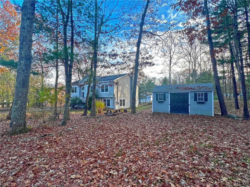160 Spruce Drive Dingmans Ferry, PA 18328 - Photo 31 of 40 a front view of a house with a yard