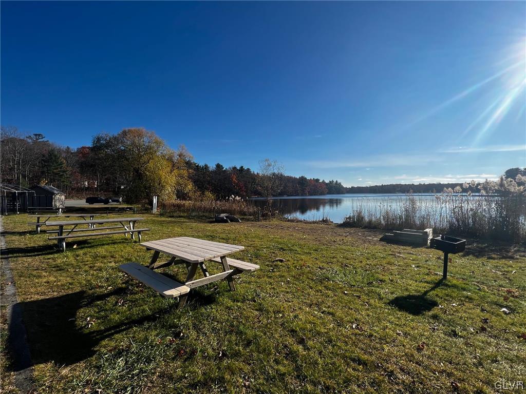 160 Spruce Drive Dingmans Ferry, PA 18328 - Photo 35 of 40 a view of a lake with a yard