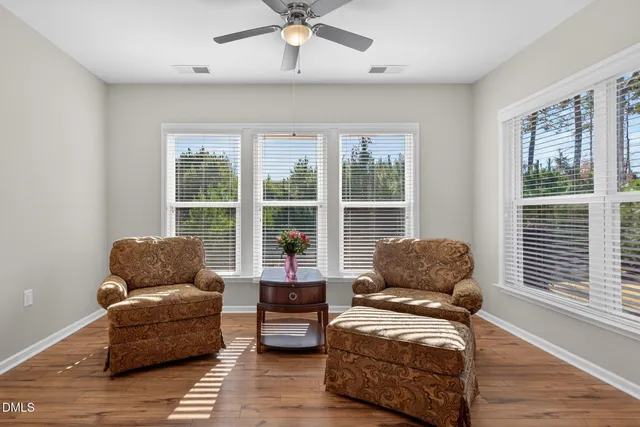 a living room with furniture and windows