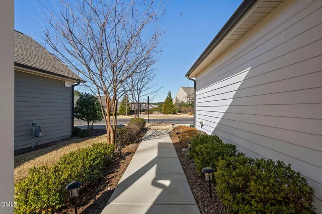 a view of a backyard with pathway