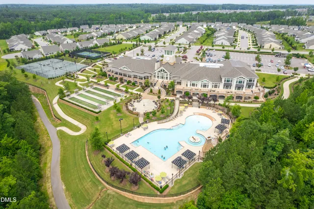an aerial view of a house with outdoor space lake view