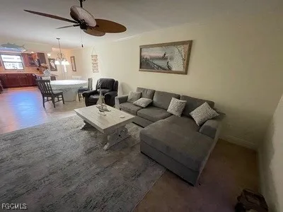 a living room with furniture and a rug