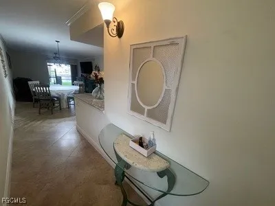 a living room with furniture and a mirror