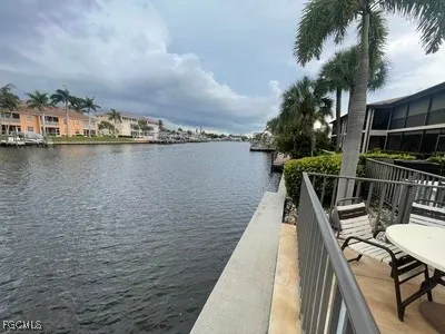 a view of a lake with sitting area