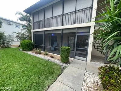 a view of house with backyard outdoor seating and plants