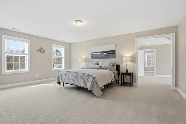 a bed room with a bed and a tv