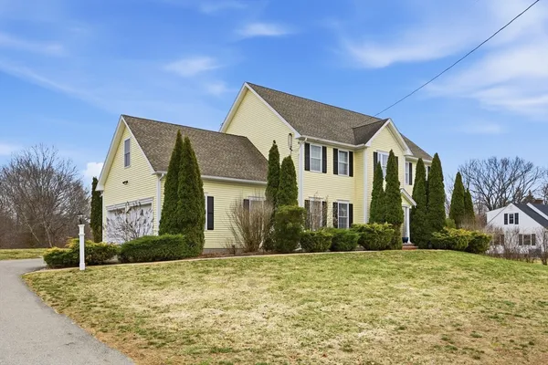 a front view of a house with a yard