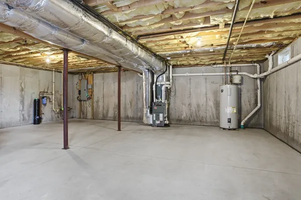 a view of empty room with wooden walls