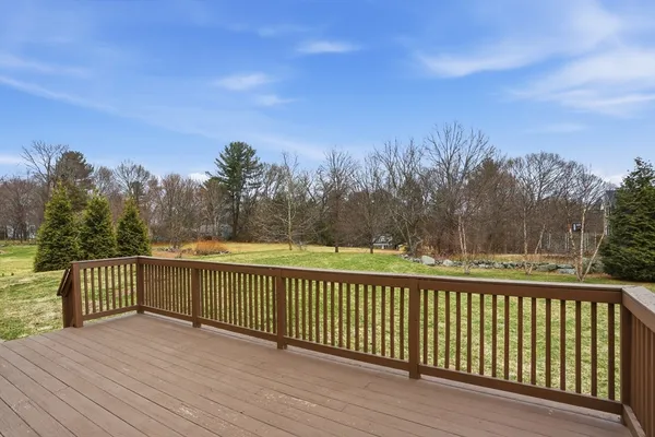 a view of a balcony with wooden fence