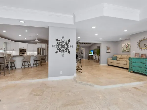 a living room with furniture and a lamp