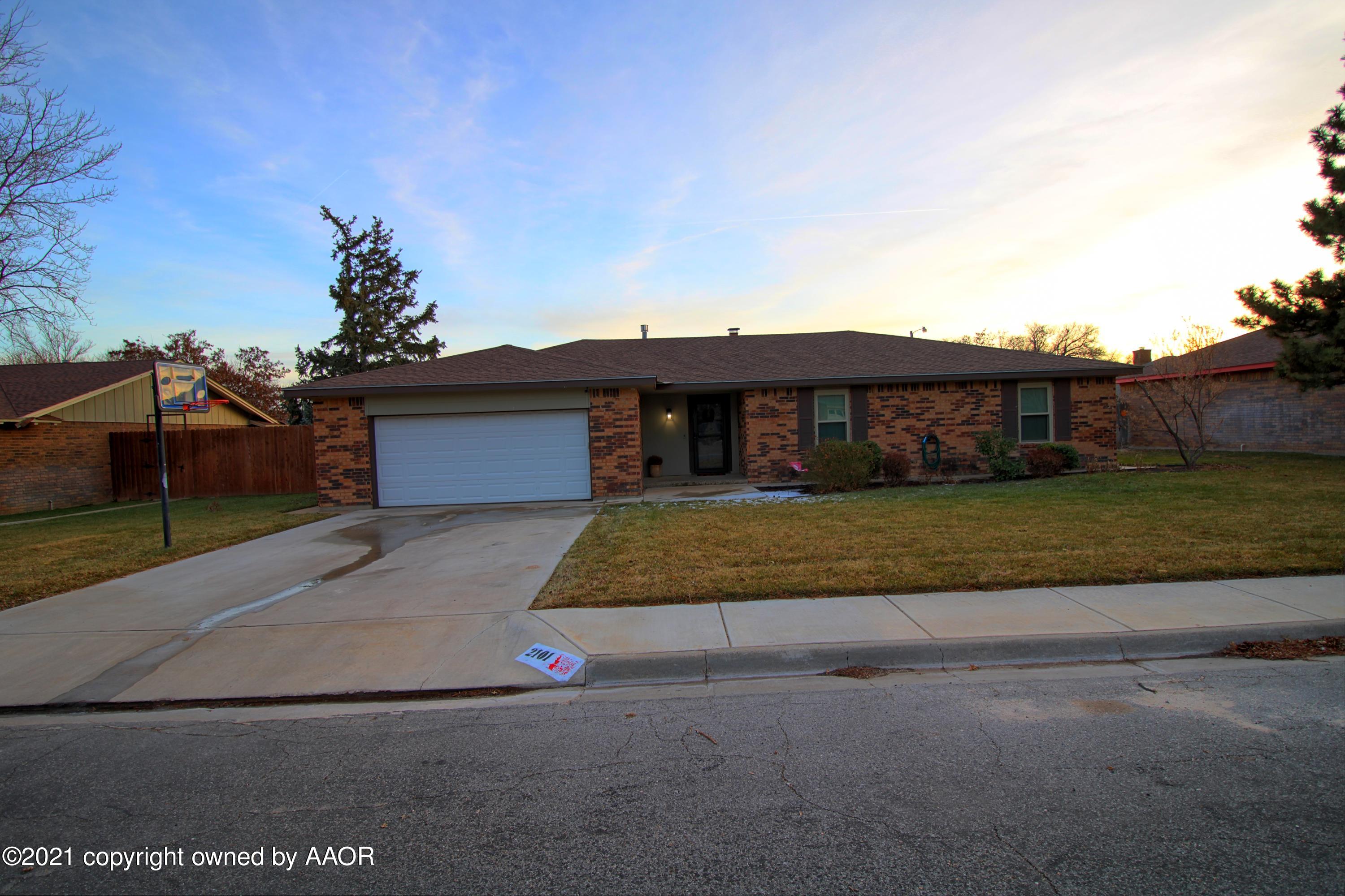 2101 Southwest 21st Avenue Perryton, TX 79070 - Photo 1 of 20 a front view of a house with a garden