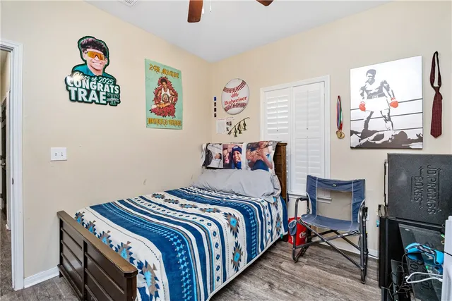 a bedroom with a bed and a dresser