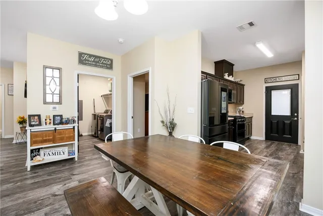 a view of a living room and dining room