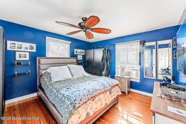 a view of a house with wooden deck and furniture